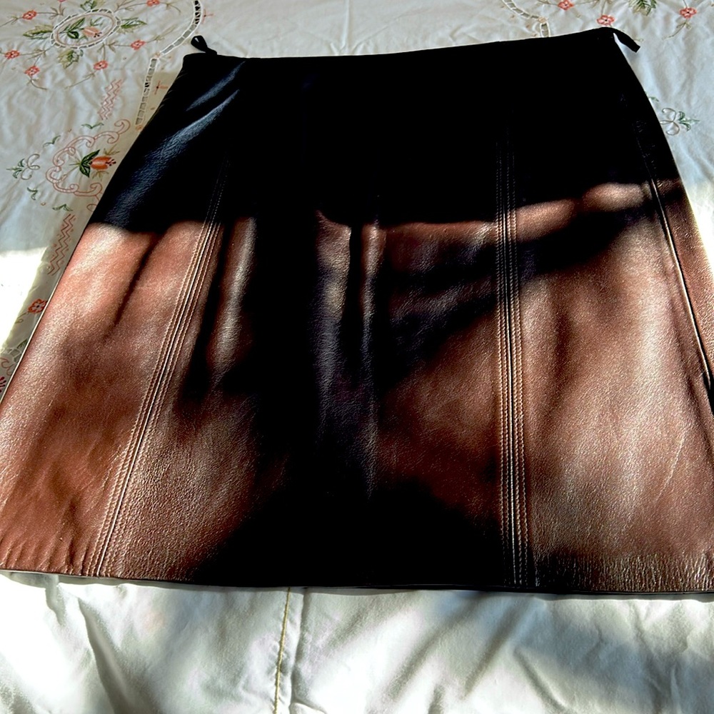 Leather skirt, lamb,size 8 chocolate in color. Fully lined. New.